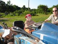 aft_2 Young Boy Steering Stationary Tractor